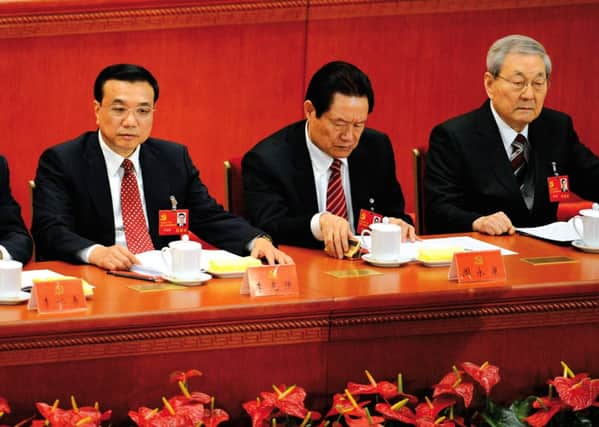 Zhou Yongkang, centre, with then premier Zhu Rongji, right, in 2012. Picture: Getty