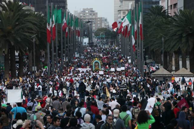Thousands join the relatives of 43 missing students from a rural teachers college for a weekend protest in Mexico City. Picture: AP