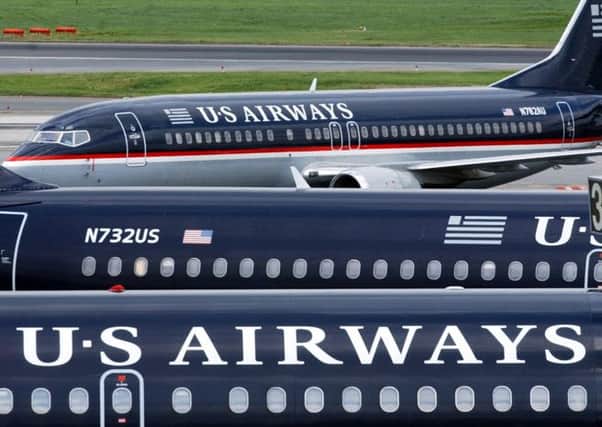 Crew members and passengers of a US Airways flight were forced to land after falling ill following a 'strange odour' that wafted through the plane. Picture: AP
