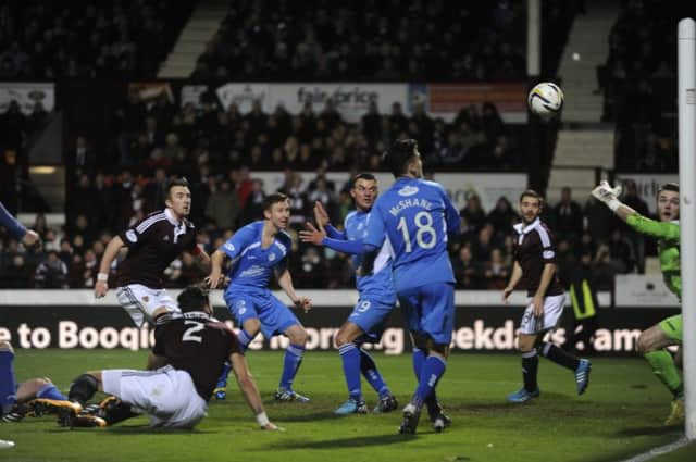Danny Wilson, left, puts Hearts back in front. Picture: Andrew OBrien