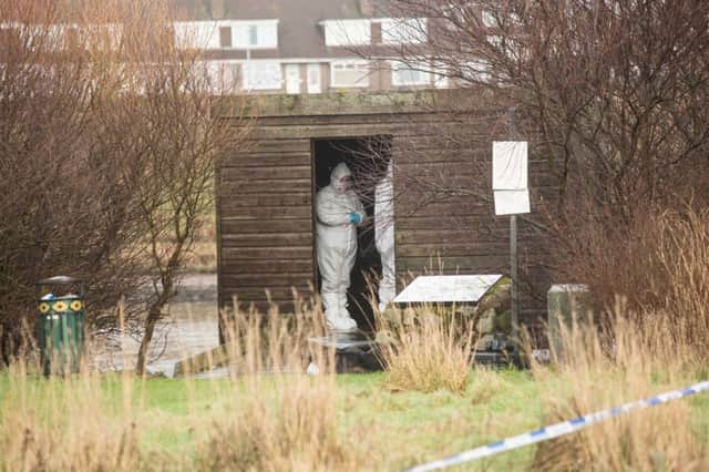 Police gathered evidence at a birdwatchers hide near the River Dee after the attack. Picture: Newsline