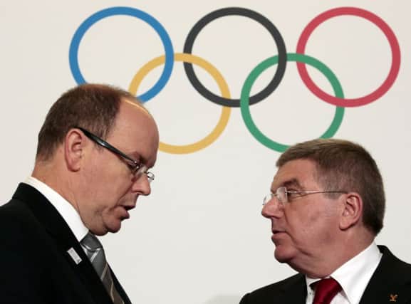 Prince Albert of Monaco talks with IOC president Thomas Bach before the 127th IOC session in the principality. Picture: Reuters