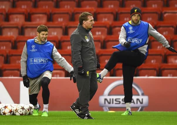 Brendan Rodgers watches Steven Gerrard and Rickie Lambert during a training session. Picture: Getty