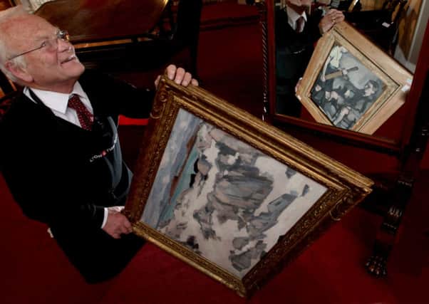 The painting has Iona on the front and his sons William and Denis on the back. Picture: Hemedia