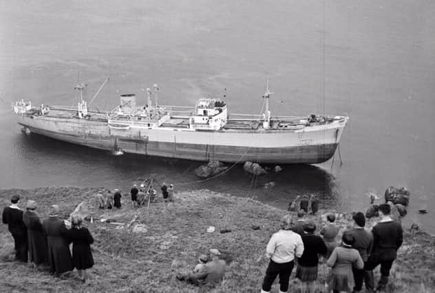 Locals observe the stricken ship on November 17, 1958. Picture: TSPL