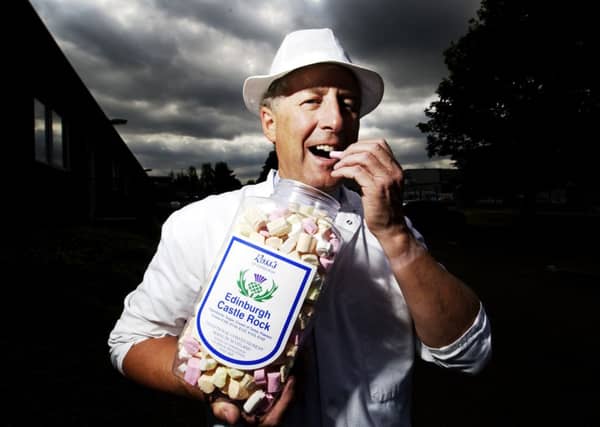 Graham Ross, owner of Ross Confectionary at Loanhead, helps himself to some Edinburgh rock. Picture: Michael Hughes