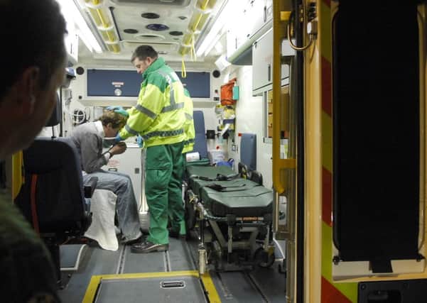 An inebriated student is helped inside an ambulance in Edinburgh's Grassmarket. Picture: Jane Barlow
