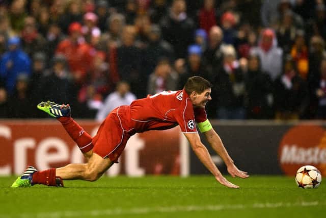 Steven Gerrard of Liverpool goes down in the area at Anfield against Basel. Picture: Getty
