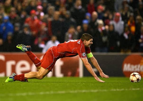 Steven Gerrard of Liverpool goes down in the area at Anfield against Basel. Picture: Getty