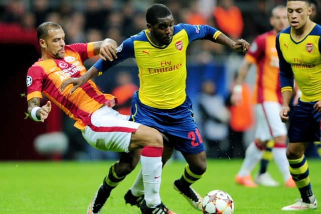 Arsenal's Joel Campbell vies for the ball with Galatasaray's Felipe Melo. Picture: Getty