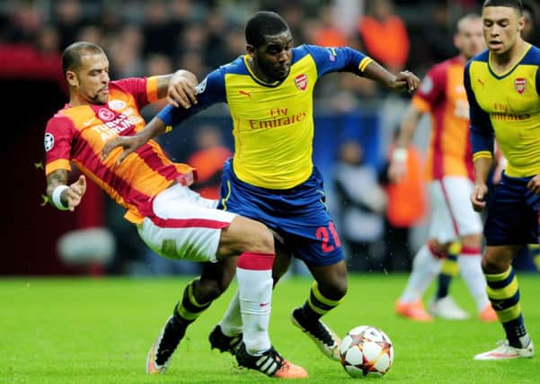 Arsenal's Joel Campbell vies for the ball with Galatasaray's Felipe Melo. Picture: Getty