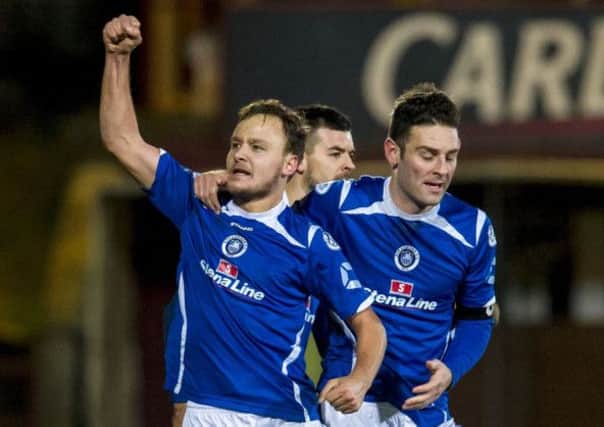 Sean Winter, left, celebrates after giving Stranraer the lead at East End Park last night. Picture: SNS
