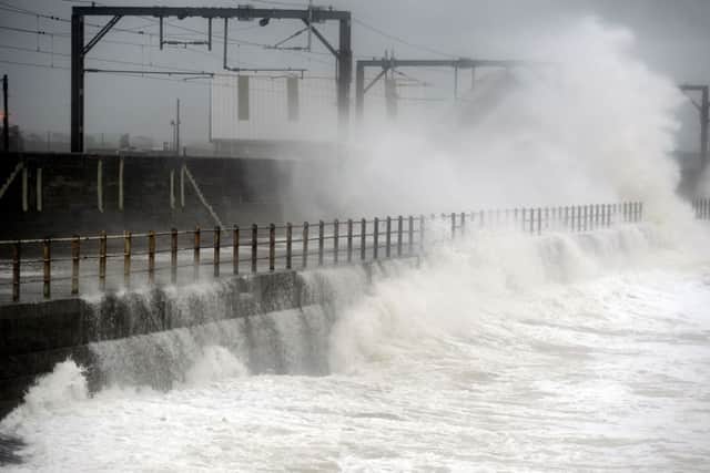 Waves hit trainlines in Saltcoats. Picture: John Devlin