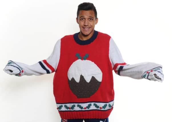 Arsenal player Alexis Sanchez in a Save the Children Christmas jumper. Picture: PA