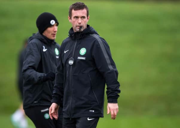 Manager Ronny Deila puts the Celtic squad through their paces. Picture: SNS