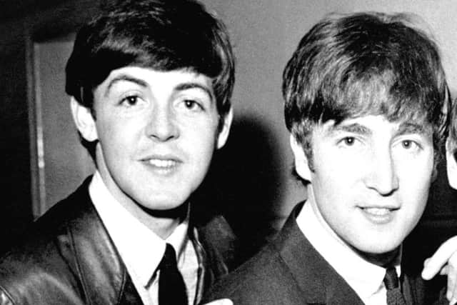 John Lennon with Paul McCartney. Picture: PA