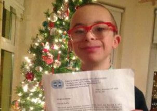 Celtic and Georgios Samaras fan Jay Beatty proudly displays his invitation to attend the sports bash in Greece. Picture: Twitter