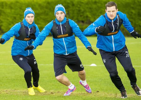 Nicky Law, left, and Rangers team-mates Nicky Clark, centre, and Jon Daly are put through their paces at Murray Park. Picture: SNS