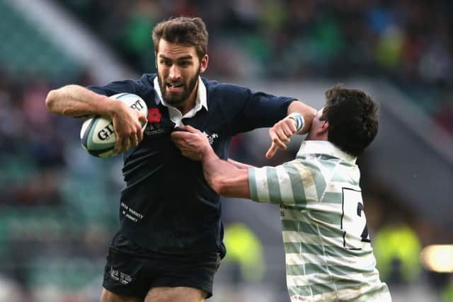 Oxfords Matt Janney holds off Thomas Pascoe of Cambridge during yesterdays Varsity Match at Twickenham. Picture: Getty