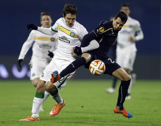 Stefan Scepovic, who scored for Celtic, jostles with Dinamos Leonardo Sigali. Picture: Darko Bandic/AP