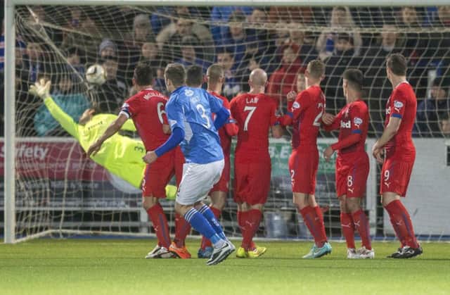 Queen of the South's Kevin Holt scores the game's opening goal. Picture: PA