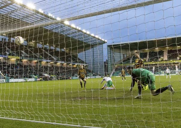 Hibernian's Danny Handling (centre) fires it home to put his side 1-0 up. Picture: SNS