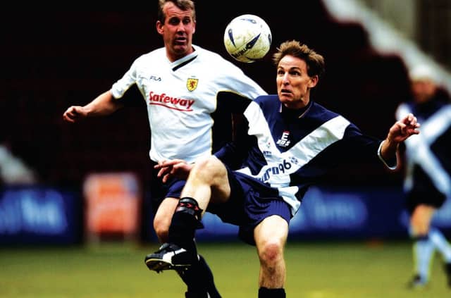 Murphy keeps his eye on the ball with Gary Mackay at a charity match at Tynecastle. Picture: Rob McDougall