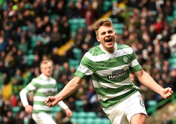 James Forrest wheels away in delight after putting Celtic 2-1 up. Picture: SNS