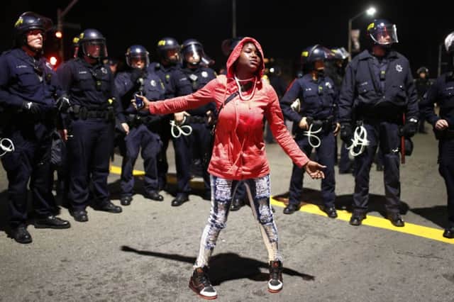 A strong police presence but no arrests in Oakland, California. Picture: Reuters