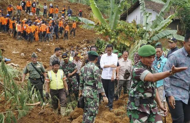 Indonesias president Joko Widodo (in white shirt) visited the disaster area yesterday. Picture: Reuters