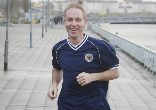 Scottish Labours new leader Jim Murphy goes for a run next to the River Clyde yesterday. Picture: PA