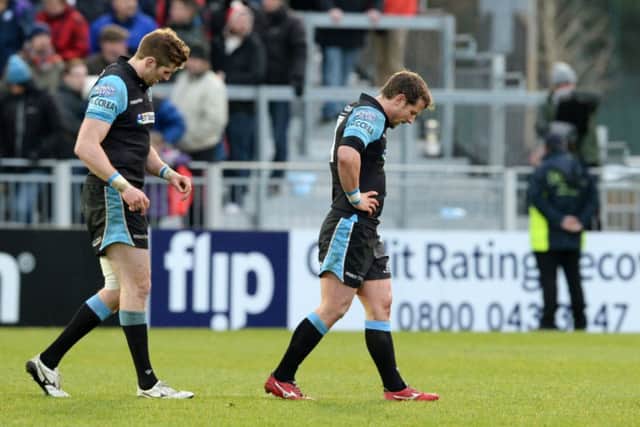 Dejected Glasgow Warriors pair Richie Vernon, left, and Peter Horne leave the field after Saturdays defeat. Picture: SNS