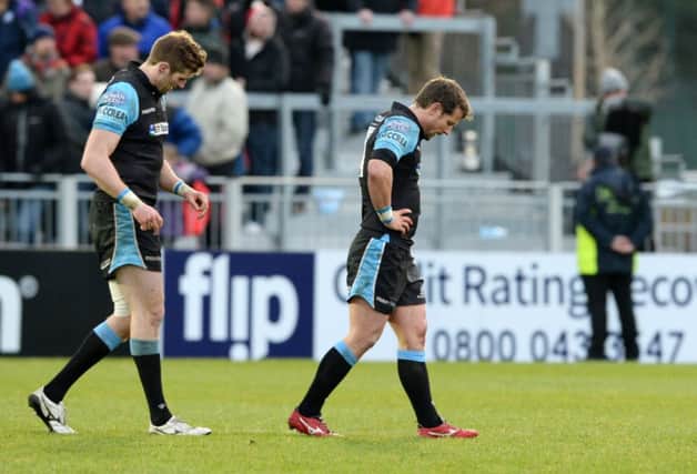 Dejected Glasgow Warriors pair Richie Vernon, left, and Peter Horne leave the field after Saturdays defeat. Picture: SNS