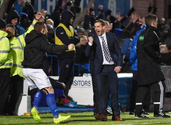 Queen of the South manager James Fowler celebrates his sides second goal. Picture: SNS