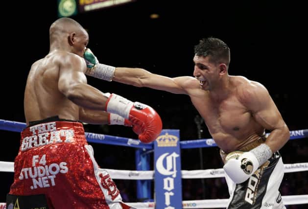 Amir Khan lands a solid right jab on the face of Devon Alexander during his convincing victory in Las Vegas at the weekend. Picture: AP