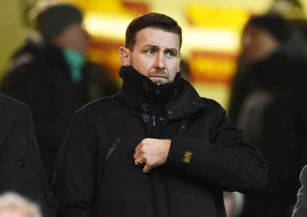 New Motherwell manager Ian Baraclough takes his place in the stand before the match. Picture: SNS