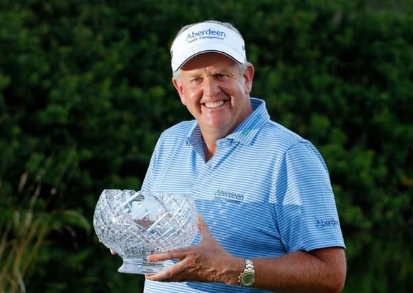 A delighted Colin Montgomerie with the John Jacobs Trophy yesterday. Picture: Getty