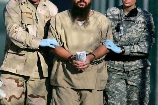 A shackled detainee is taken for questioning at Guantanamo. Picture: AP