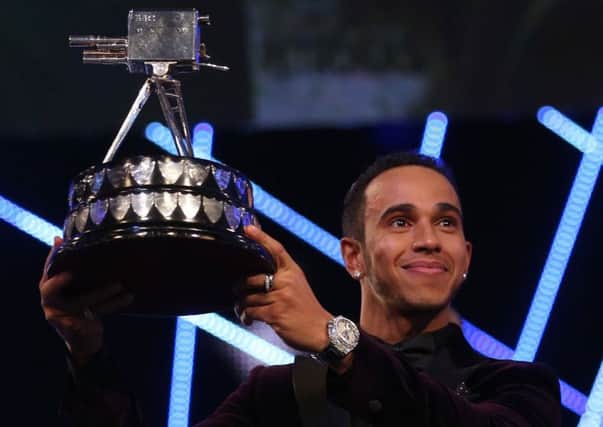 Lewis Hamilton with the Sports Personality of the Year trophy at the SSE Hydro, Glasgow. Picture: PA