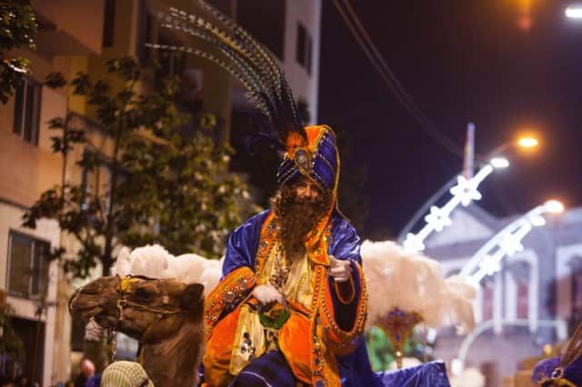 Melchior, one of the Wise Men rides through town by camel. Picture: AFP/Getty