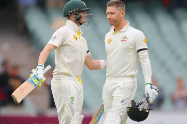 Steven Smith congratulates captain Michael Clarke on his century last week against India in Adelaide. Picture: Getty