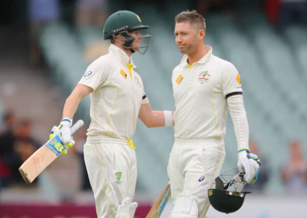 Steven Smith congratulates captain Michael Clarke on his century last week against India in Adelaide. Picture: Getty