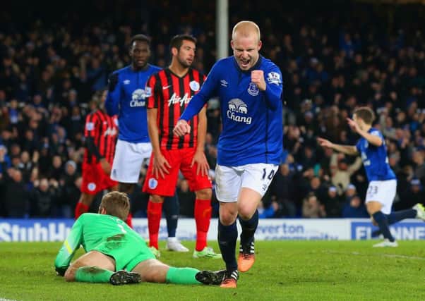 Steven Naismith celebrates after putting Everton 3-0 ahead in the second half last night.  Picture: Getty