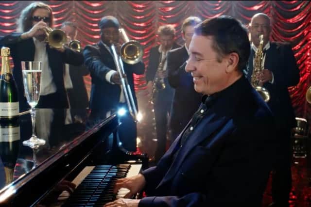 Jools Holland features in Aldis Christmas advertising campaign. Both Aldi and Lidl sales advanced
