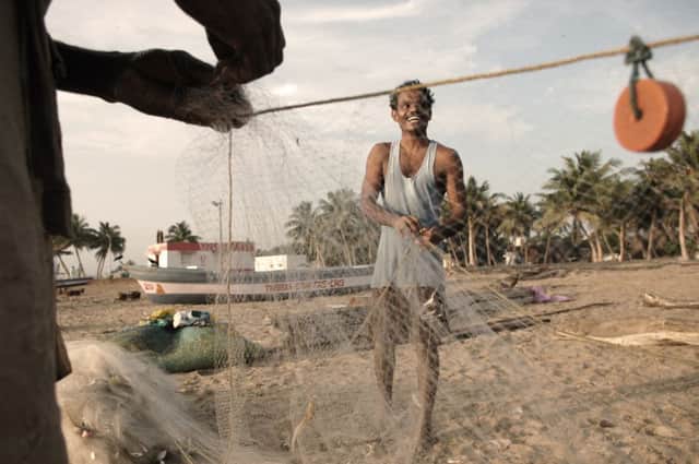 Thiyagarajan and his fellow fishermen on Vailankanni beach. Picture: Sephi Bergerson