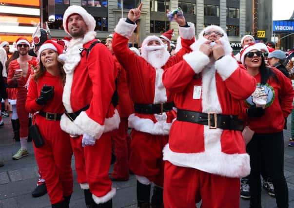 Santas, Santas everywhere. People enjoy Santacon. Picture: Getty