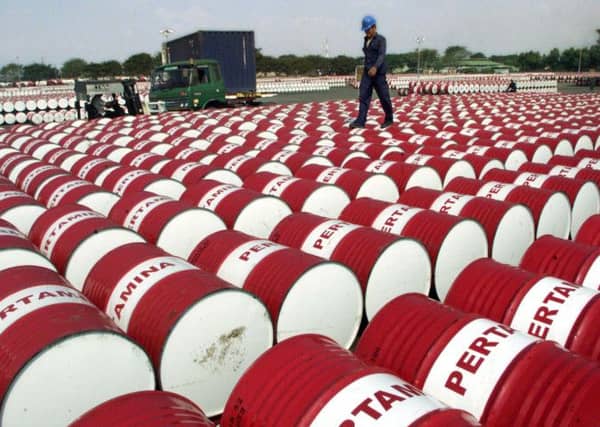 Oil estimates made by the SNP before the referendum are coming under scrutiny as the oil price continues to drop. Picture: AP