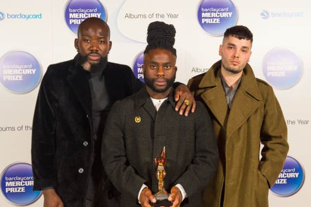 Young Fathers, (left to right)  'G' Hastings, Alloysious Massaquoi, and Kayus Bankole, with their Mercury Music Prize. Picture: PA