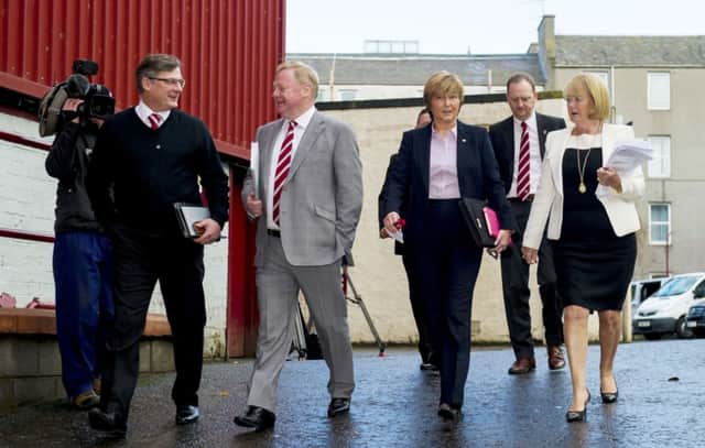 Craig Levein, left, Ann Budge, right and her business partners Eric Hogg and Jacqui Duncan arrive at Tynecastle. Picture: SNS