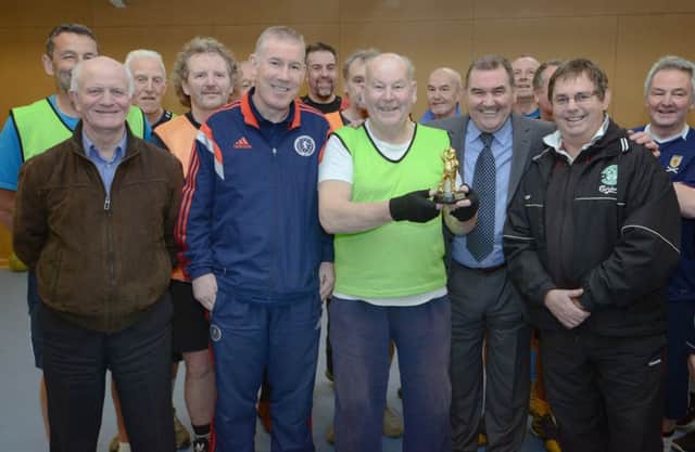 Jackie McNamara Snr yesterday helped present the Walking Football player of the year award to 83yearold Peter Collins. Picture: Neil Hanna